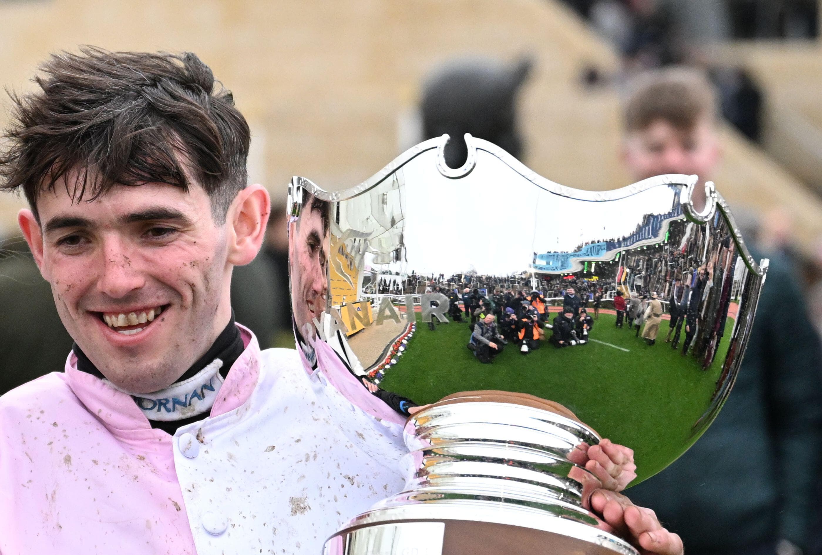 Jockey Darragh O'Keeffe with the Ryanair Chase trophy at Cheltenham — a SportsTax client